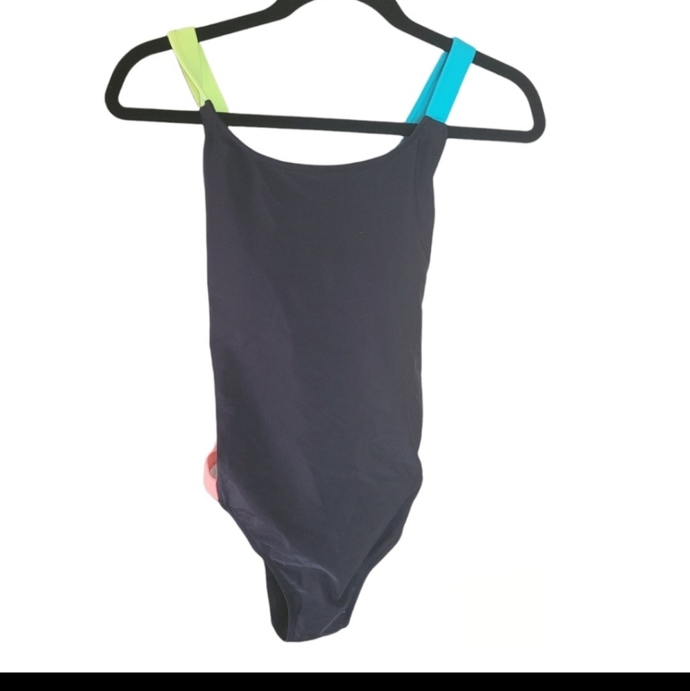 Black bathing suit with multi criss cross straps. Never worn. Sized XL.